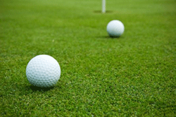 golf-balls-on-green-250